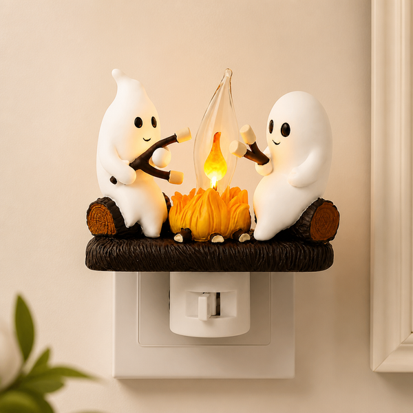 Ghost campfire night light glowing on a wall outlet
